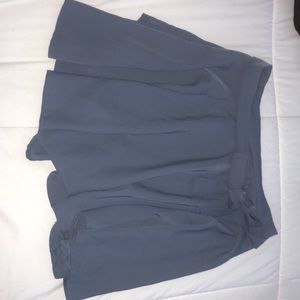 Dusty blue/grey flows wrap around skirt.